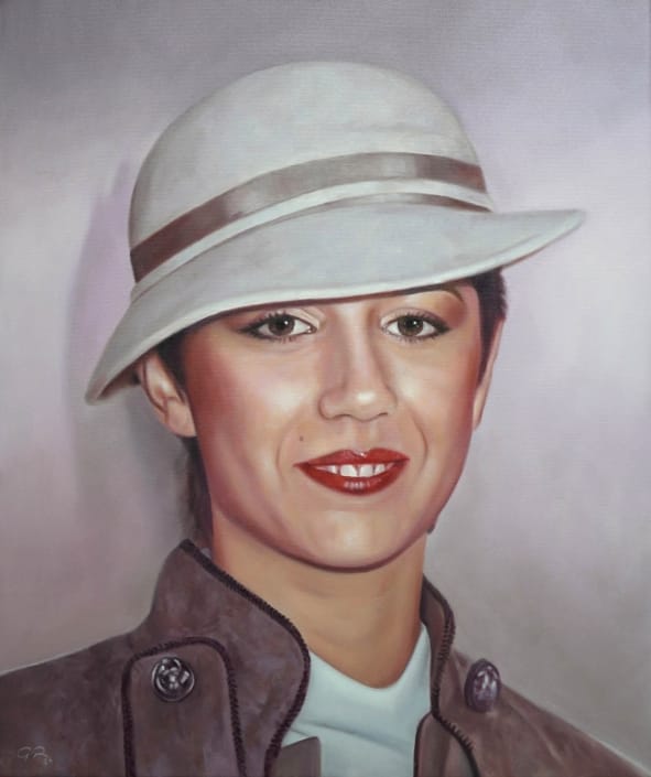 Retrato al óleo de una mujer con sombrero